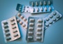 white and blue medication pill blister pack