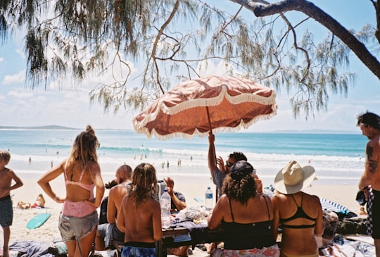 people sitting on beach during daytime in Noosa Main Beach Australia