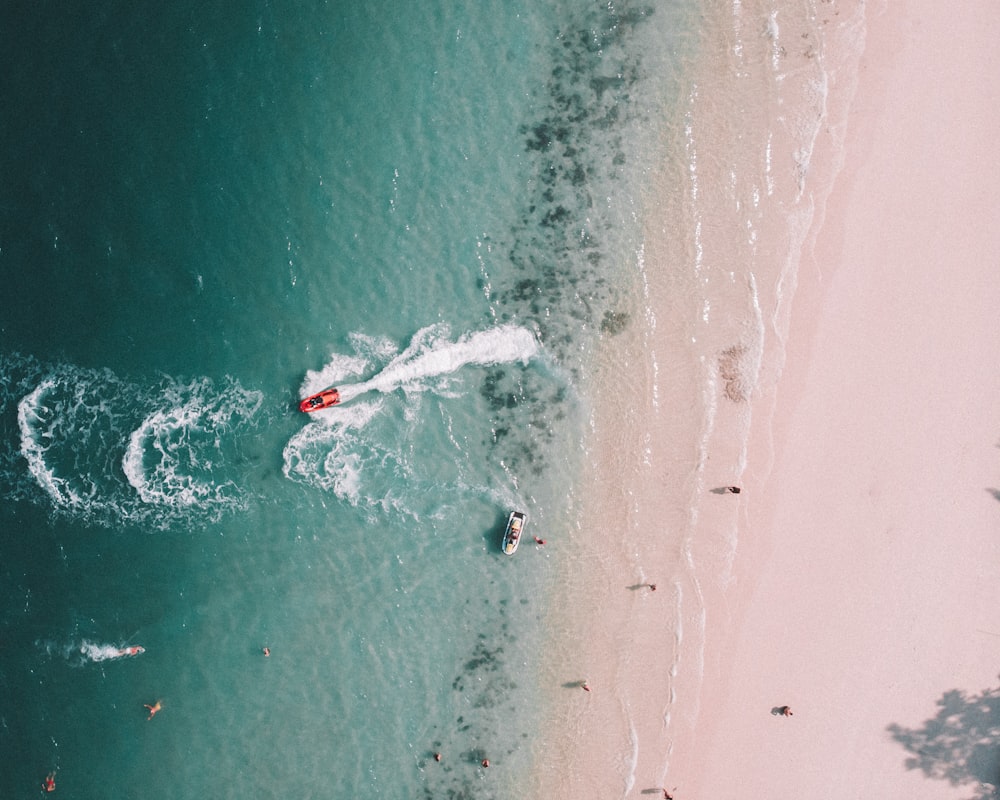 person surfing on sea waves during daytime