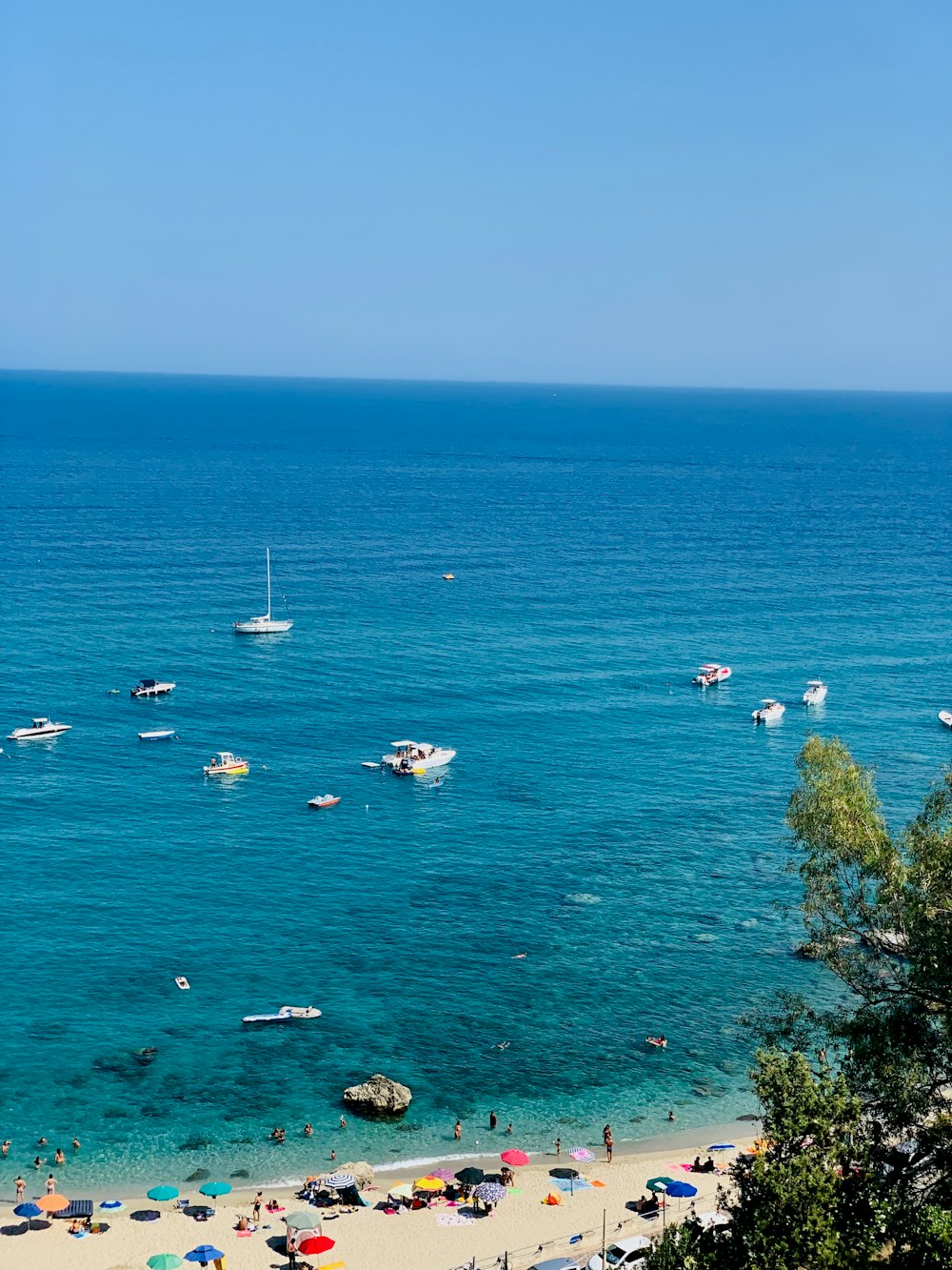 white boats on sea during daytime