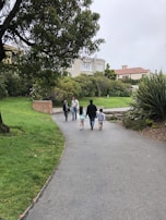 A group of friends enjoying a walk in a park.