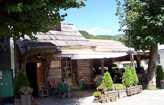Cozy rural roadside snack bar with welcoming entrance and rustic charm.