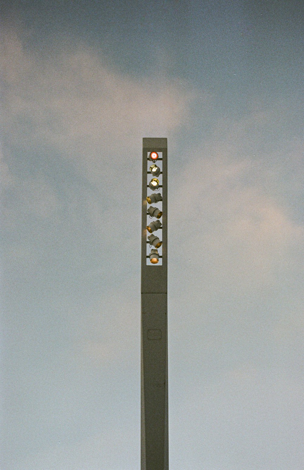 black and white cross under gray sky