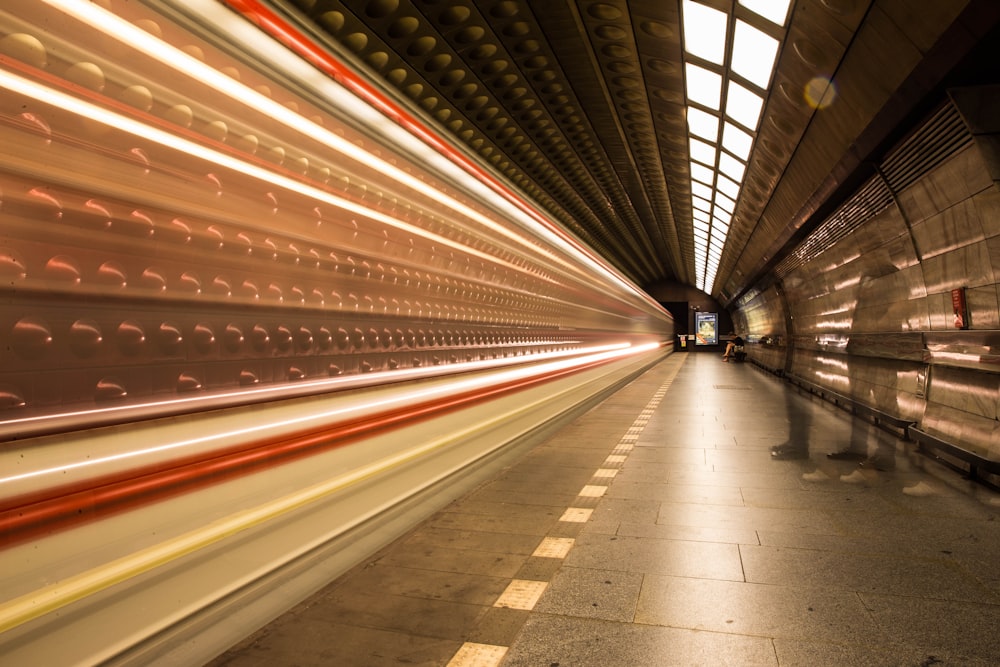 time lapse photography of train station