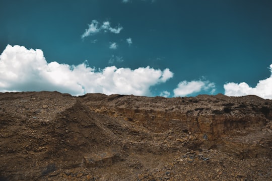 brown rocky mountain under blue sky and white clouds during daytime in Skrapar District Albania