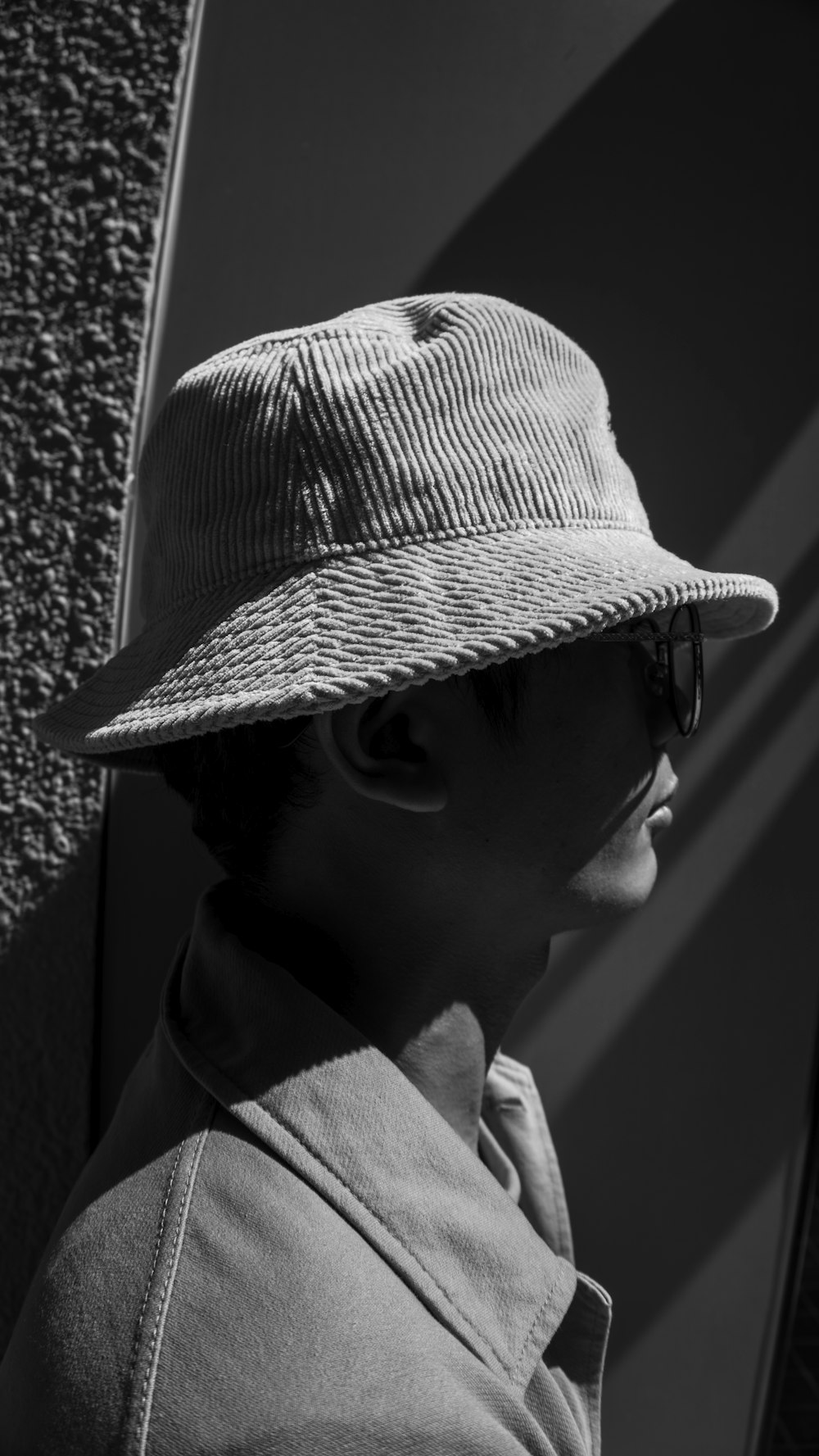 grayscale photo of man wearing hat