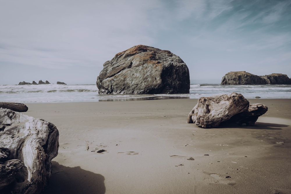 brown rock formation on sea shore during daytime