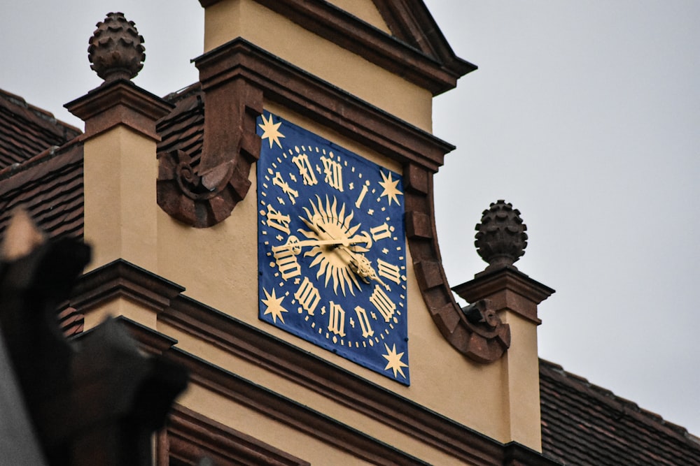 brown and black analog clock at 10 00