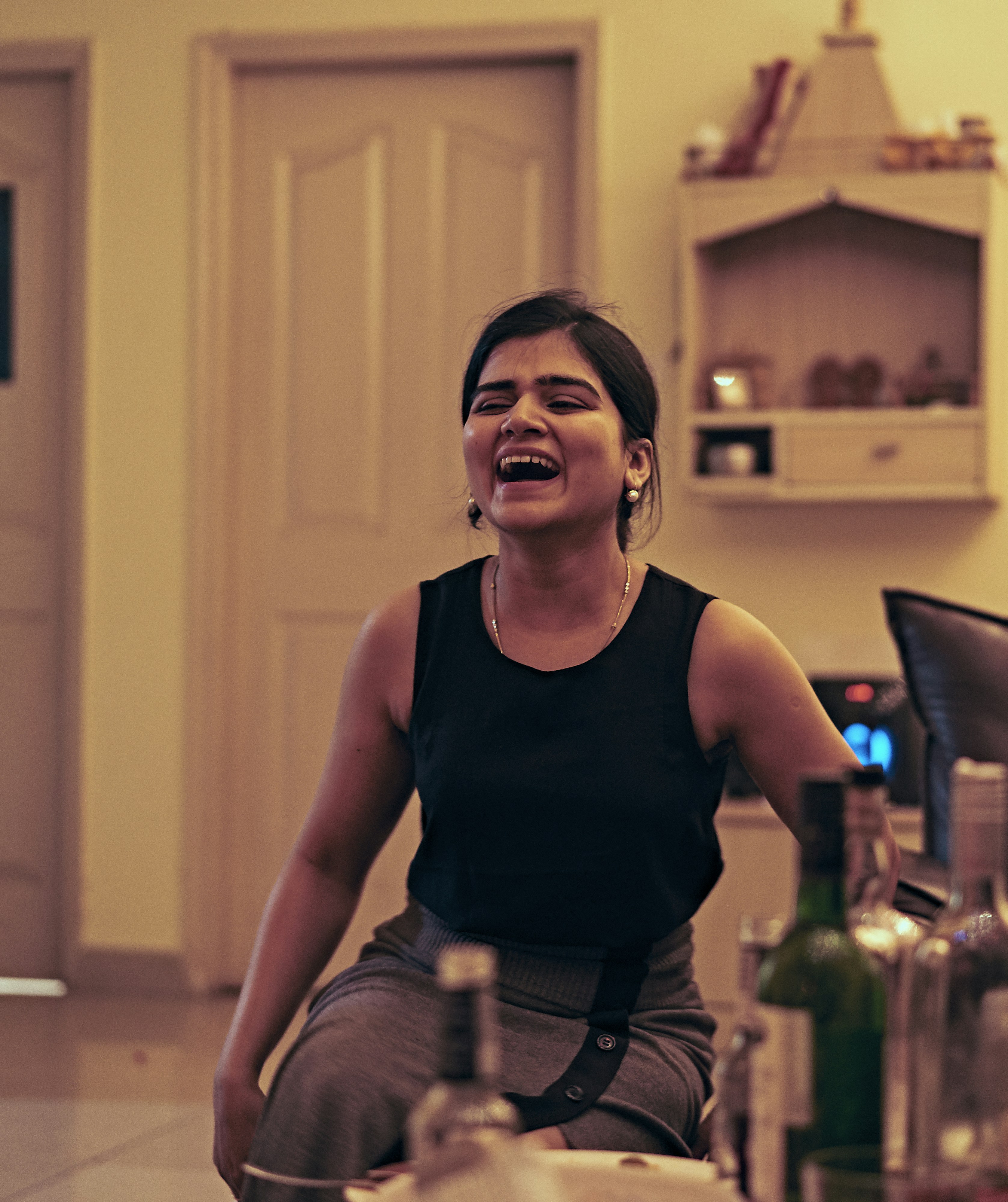 woman in black tank top sitting on chair
