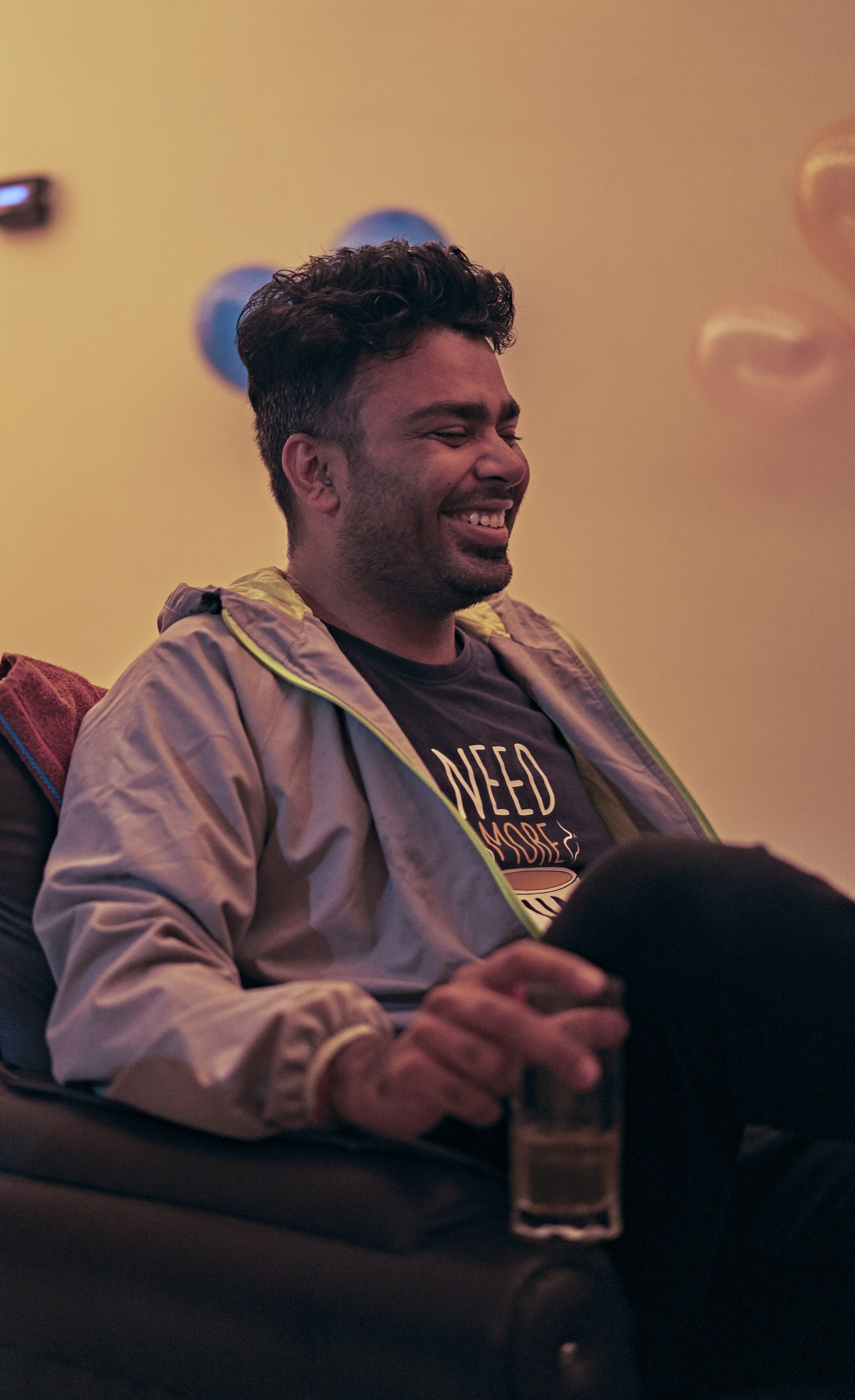 man in gray jacket smiling