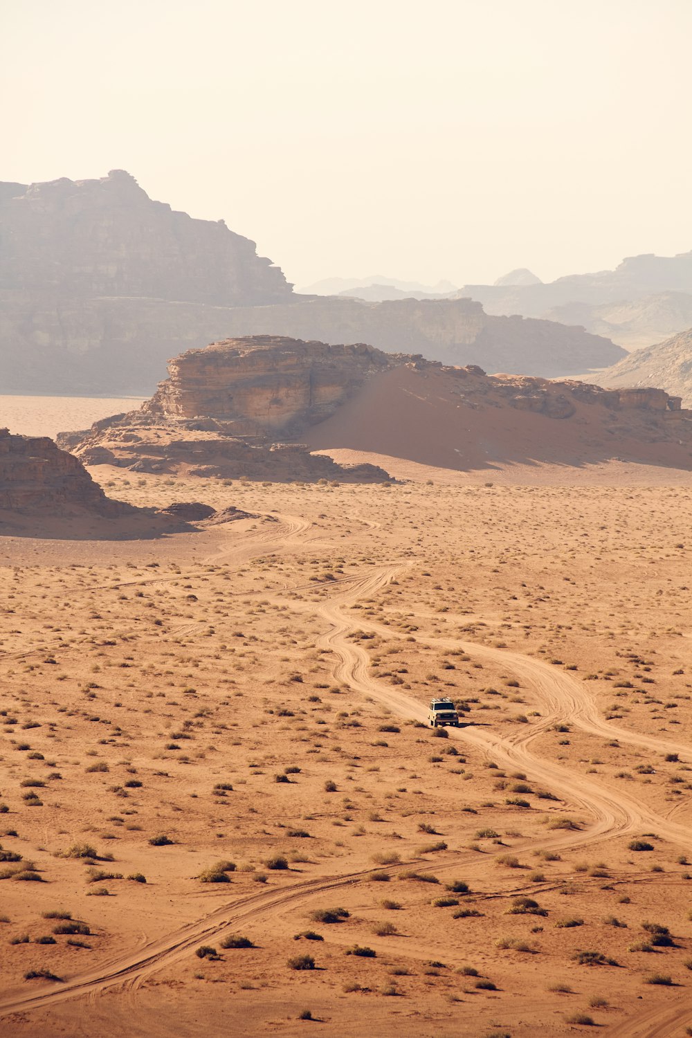 person walking on sand during daytime