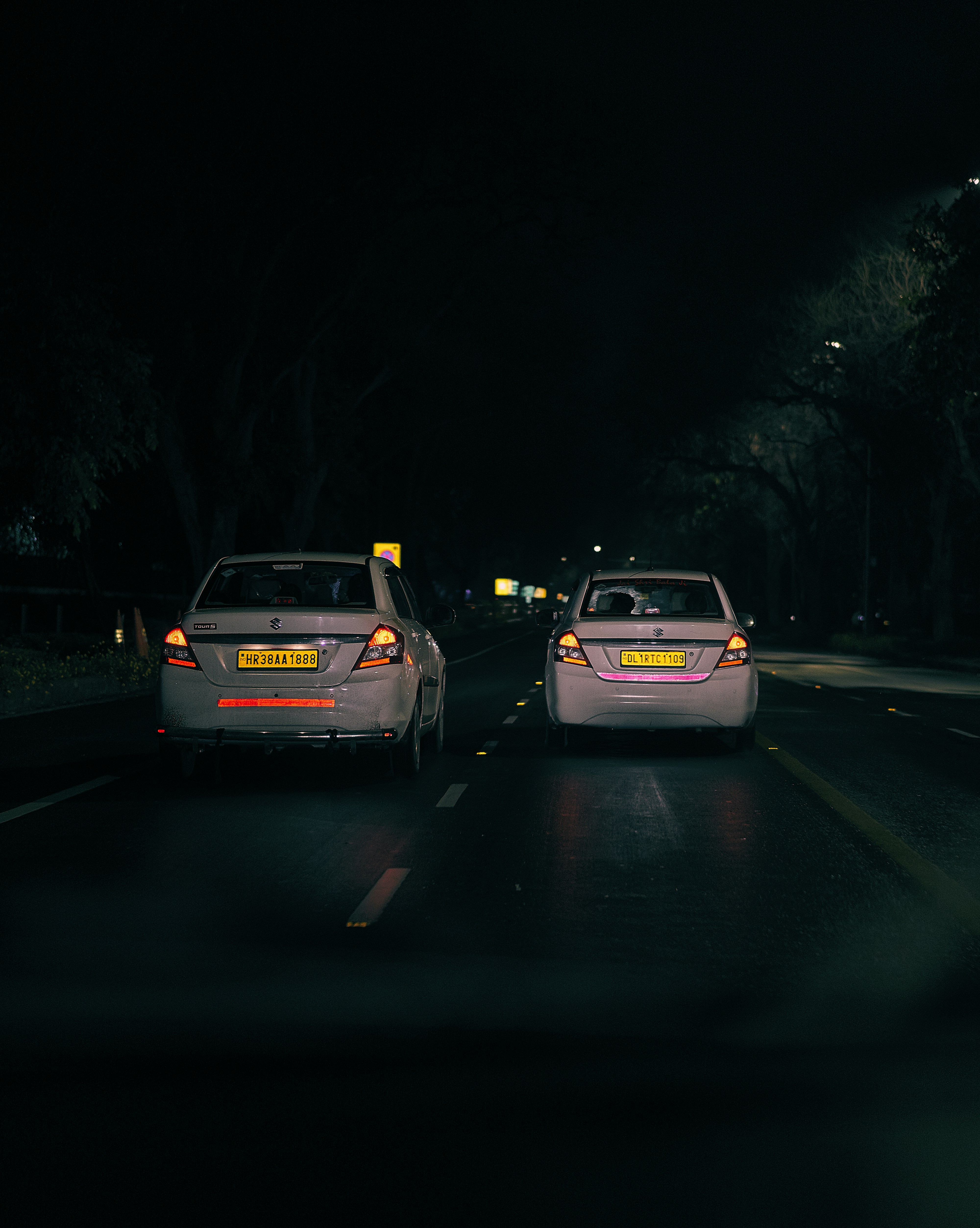white car on road during night time