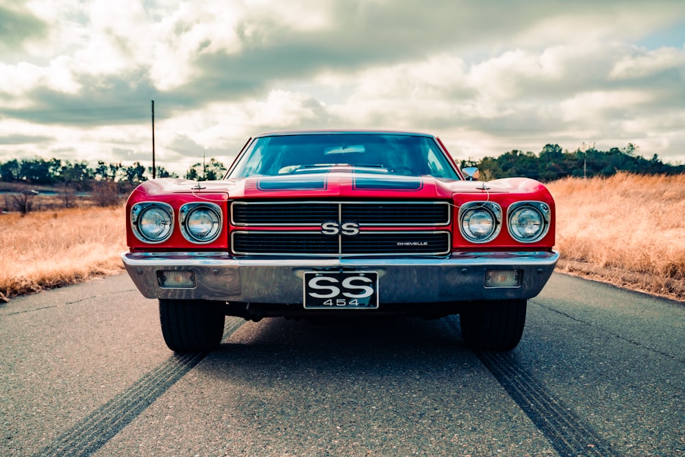 red chevrolet camaro on road during daytime