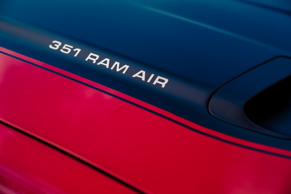 red car with blue and white text