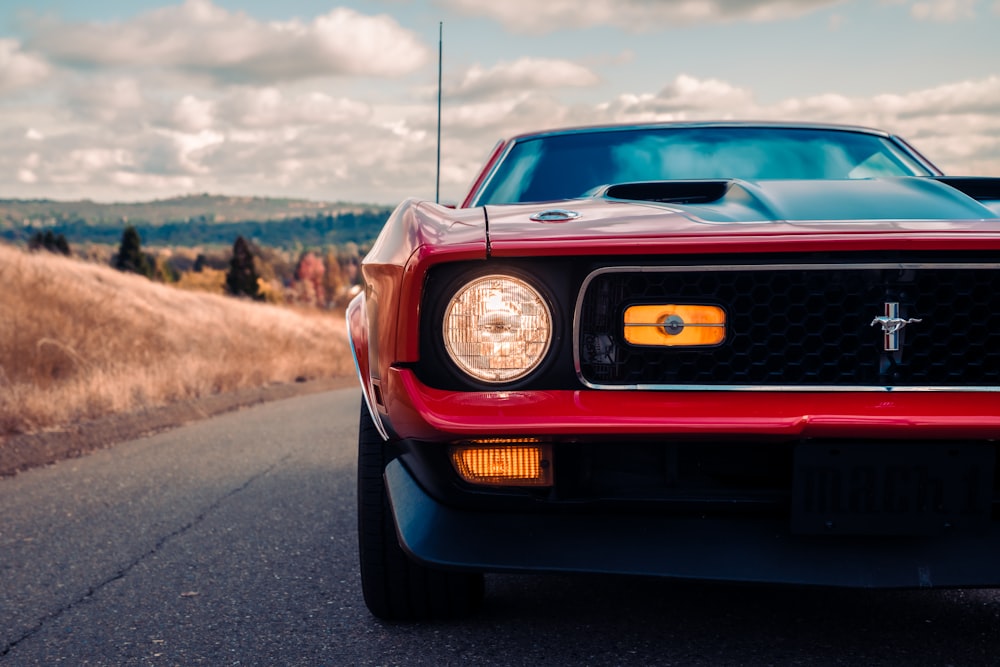 red car on road during daytime