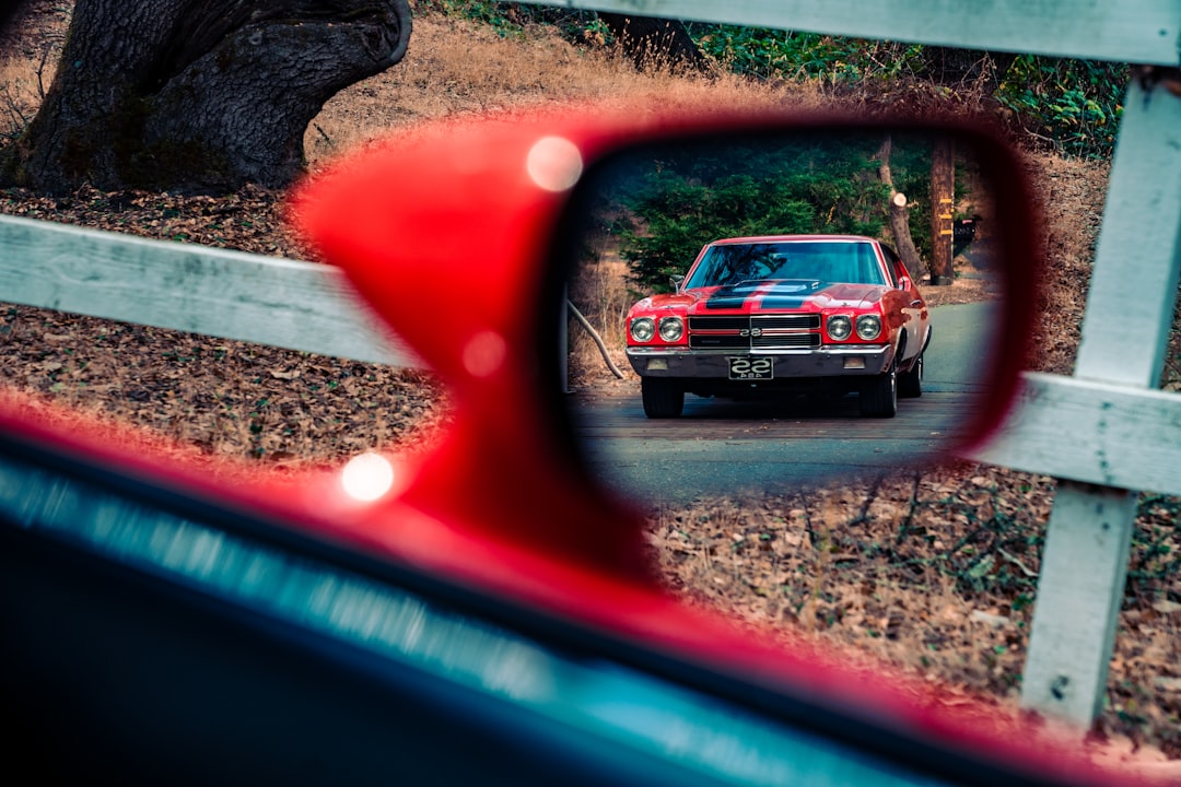 red car on road during daytime