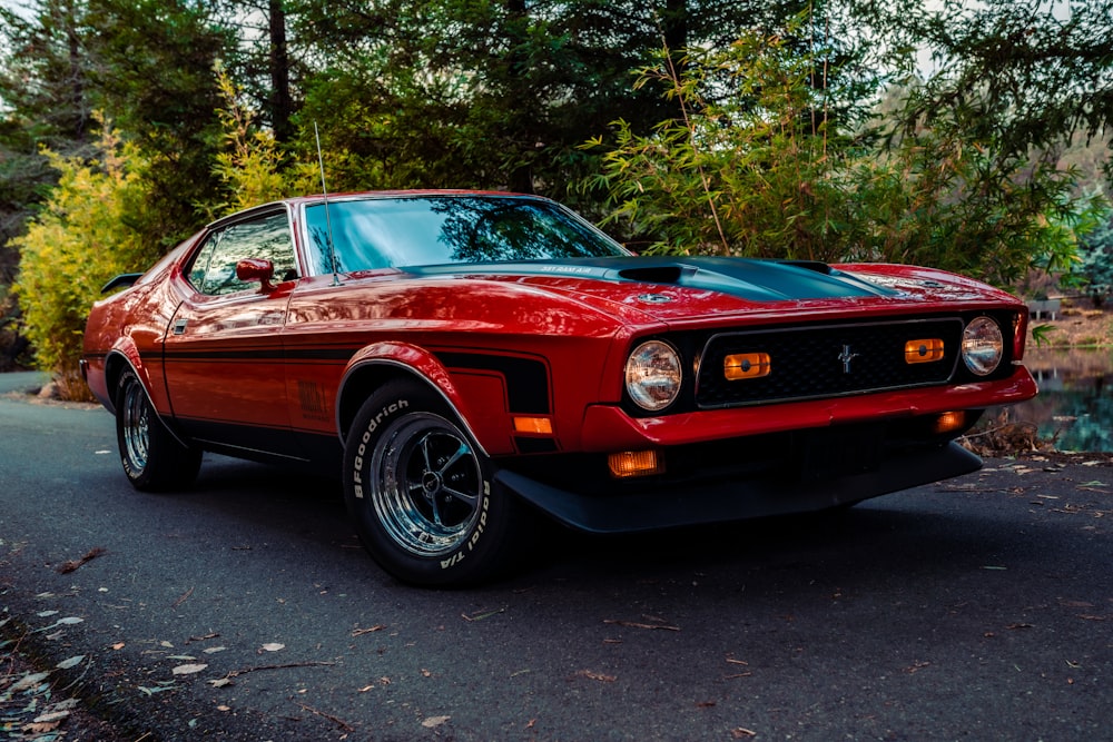 brown chevrolet camaro on road during daytime