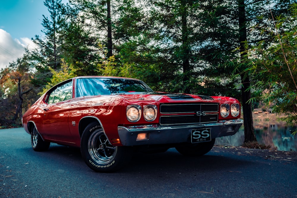 red chevrolet camaro on road during daytime