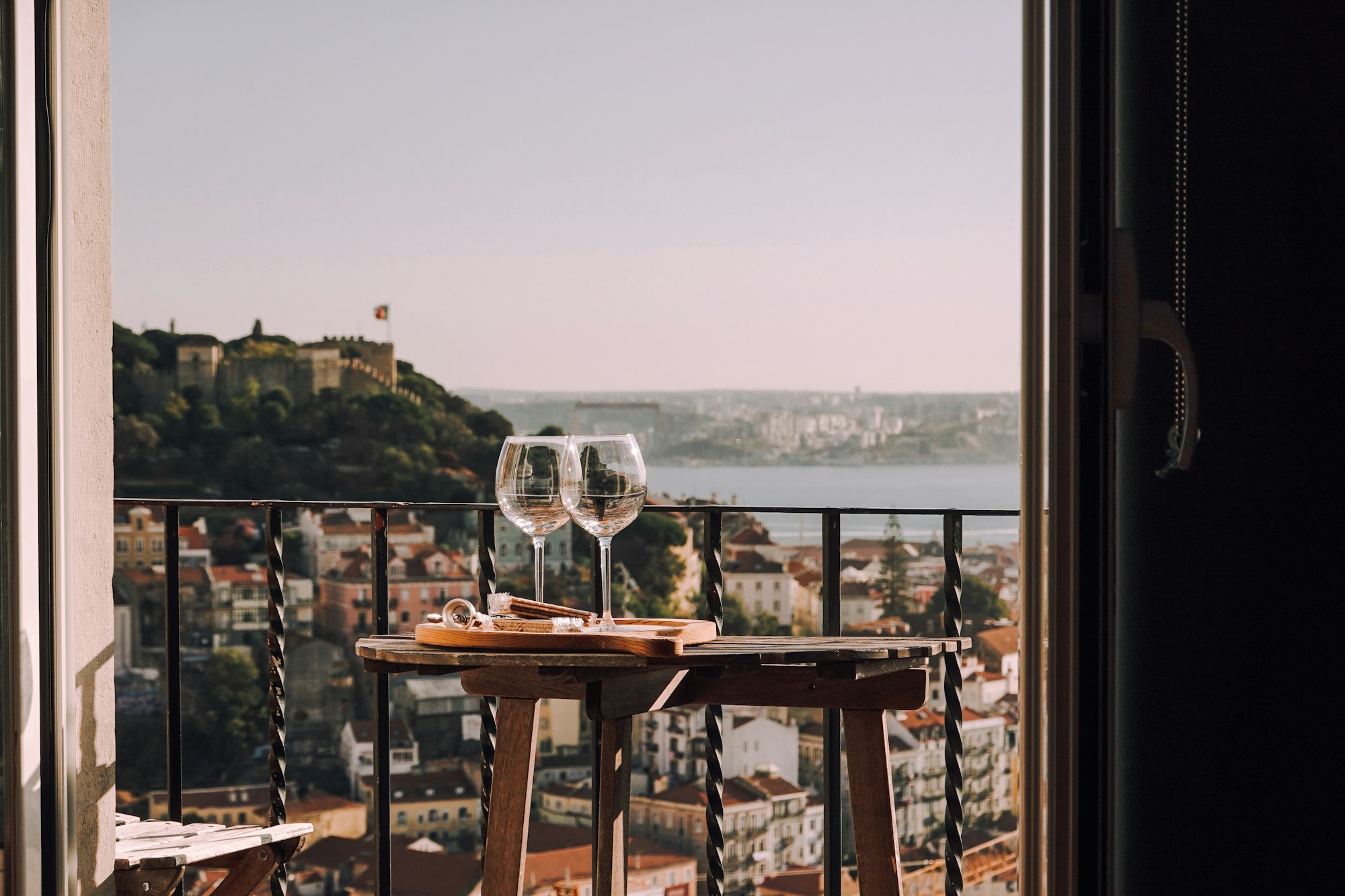 Two glasses and Lisbon in the background