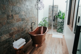 brown plastic bucket near white framed glass door