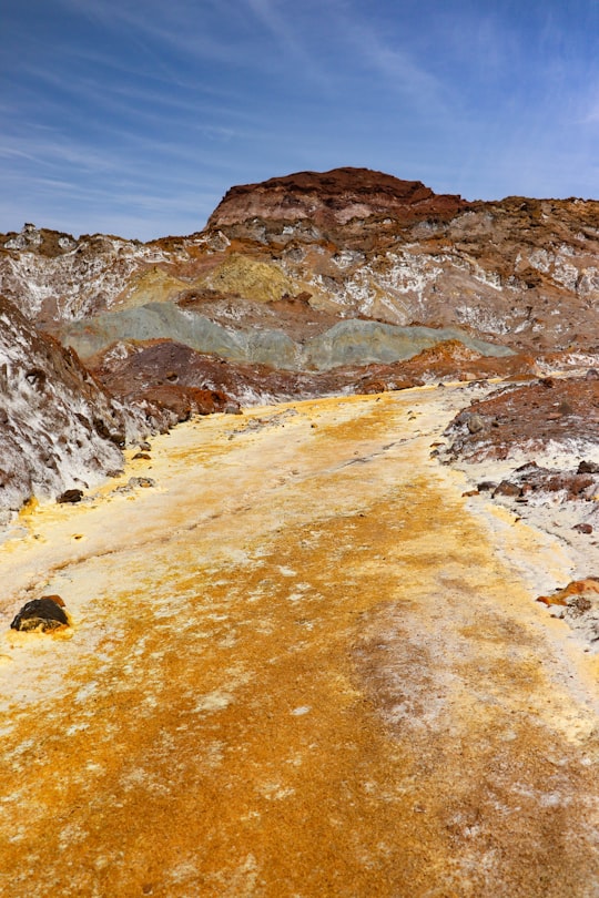 brown rocky mountain under blue sky during daytime in Hormuz Island Iran