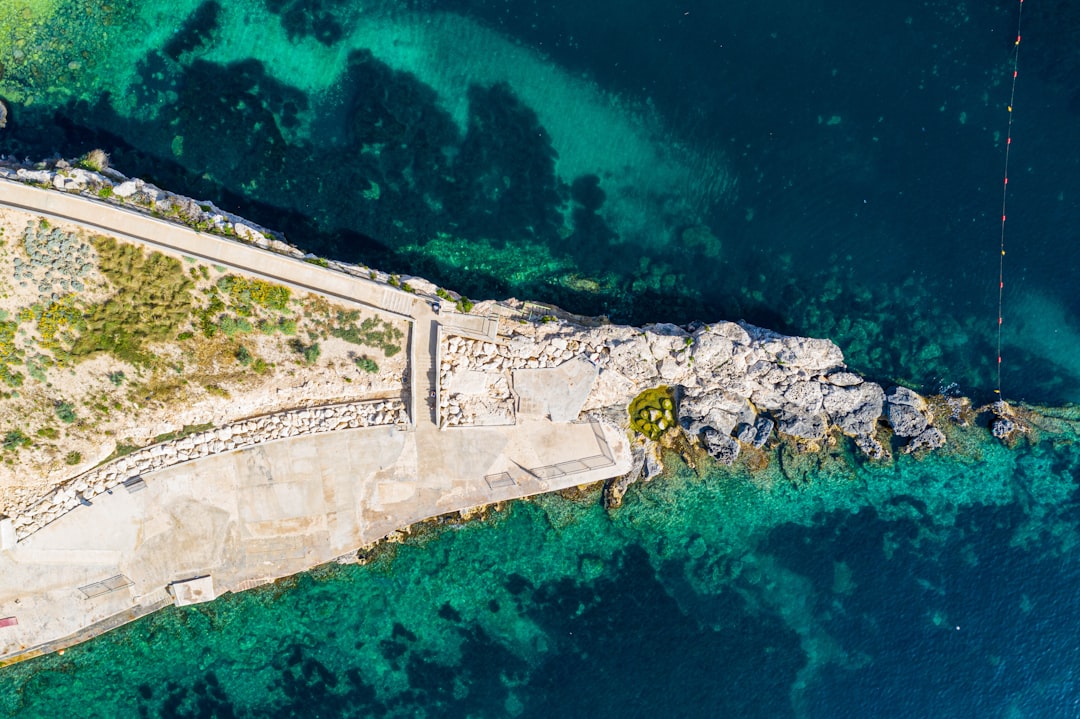 Coastal and oceanic landforms photo spot Fekruna Għajn Tuffieħa