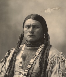 A dignified portrait of Prophetess Nkeiru Ihezuo bathed in soft royal purple and gold light, embodying grace and spiritual authority.