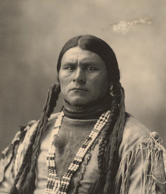 Portrait of Dalyon Shemil Benitez in a warm earth-toned setting, embodying strength and compassion.