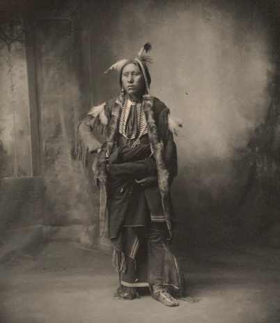 Black and white portrait of a traditional Chilean folk dancer in costume from the early 1900s.