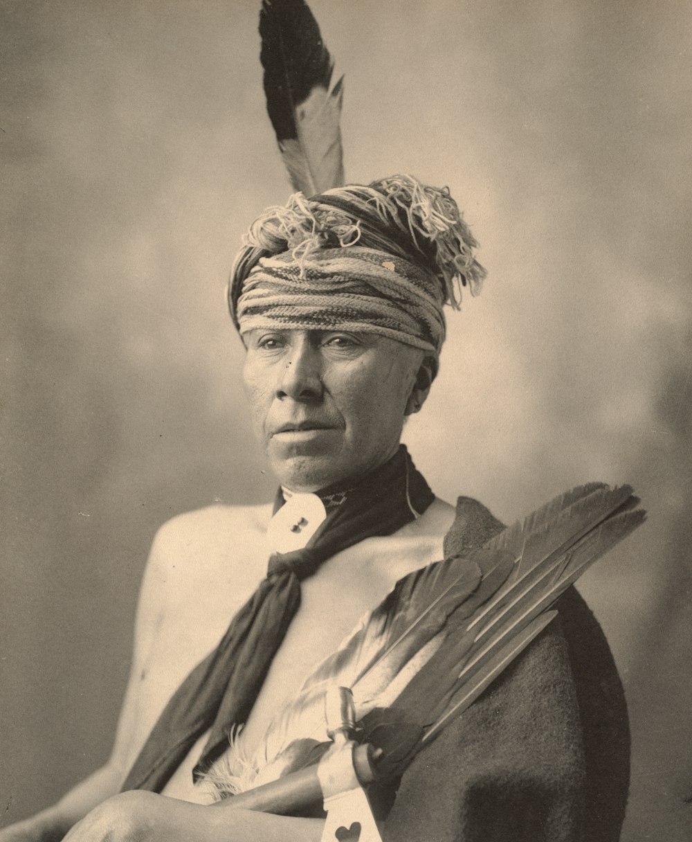 grayscale photo of man wearing hat