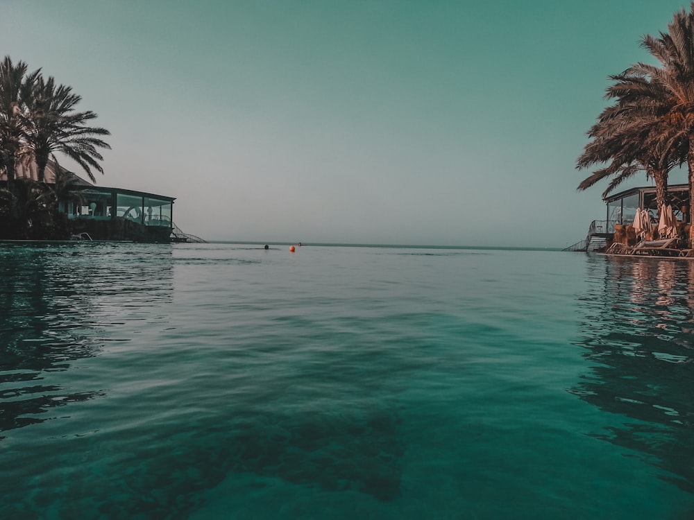 body of water under blue sky during daytime