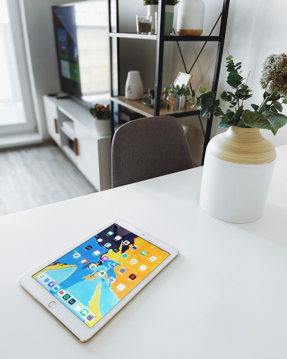 white ipad on white table