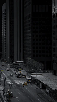 cars parked on the side of the road in the city