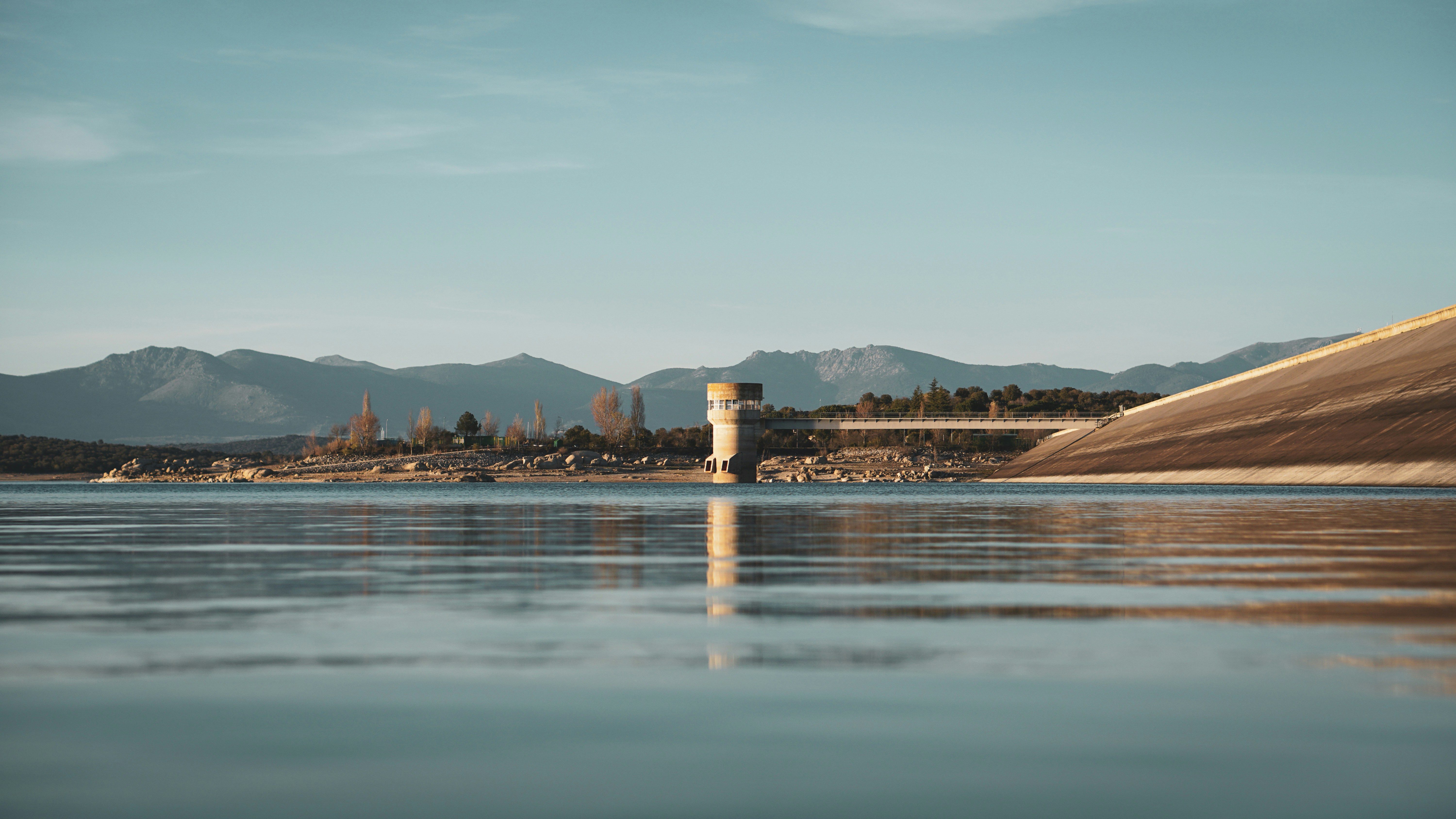 brown wooden dock on body of water during daytime
