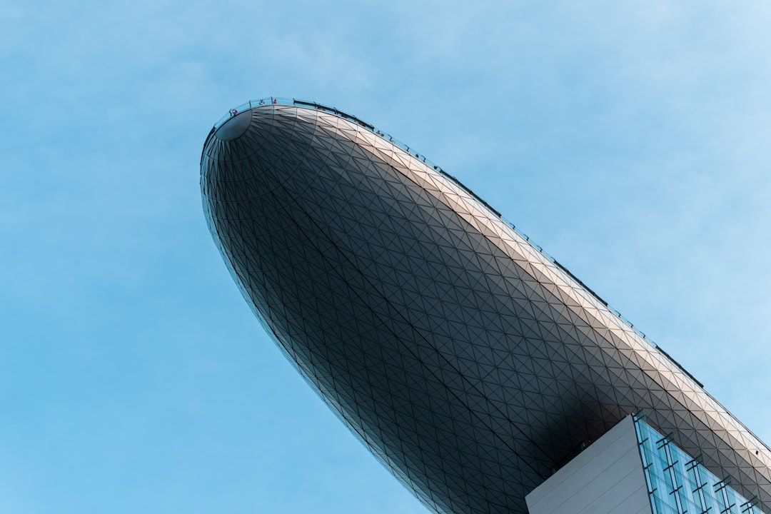 white and black concrete building under blue sky during daytime