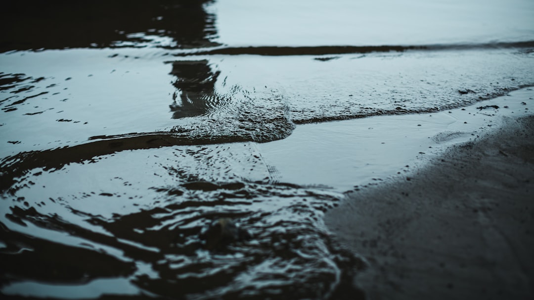 water wave on shore during daytime