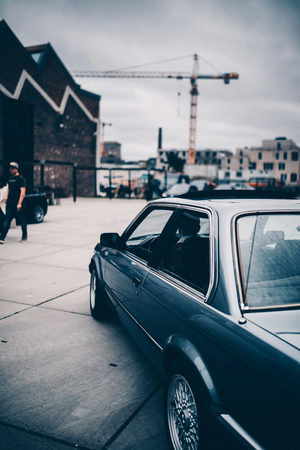 black sedan on road during daytime