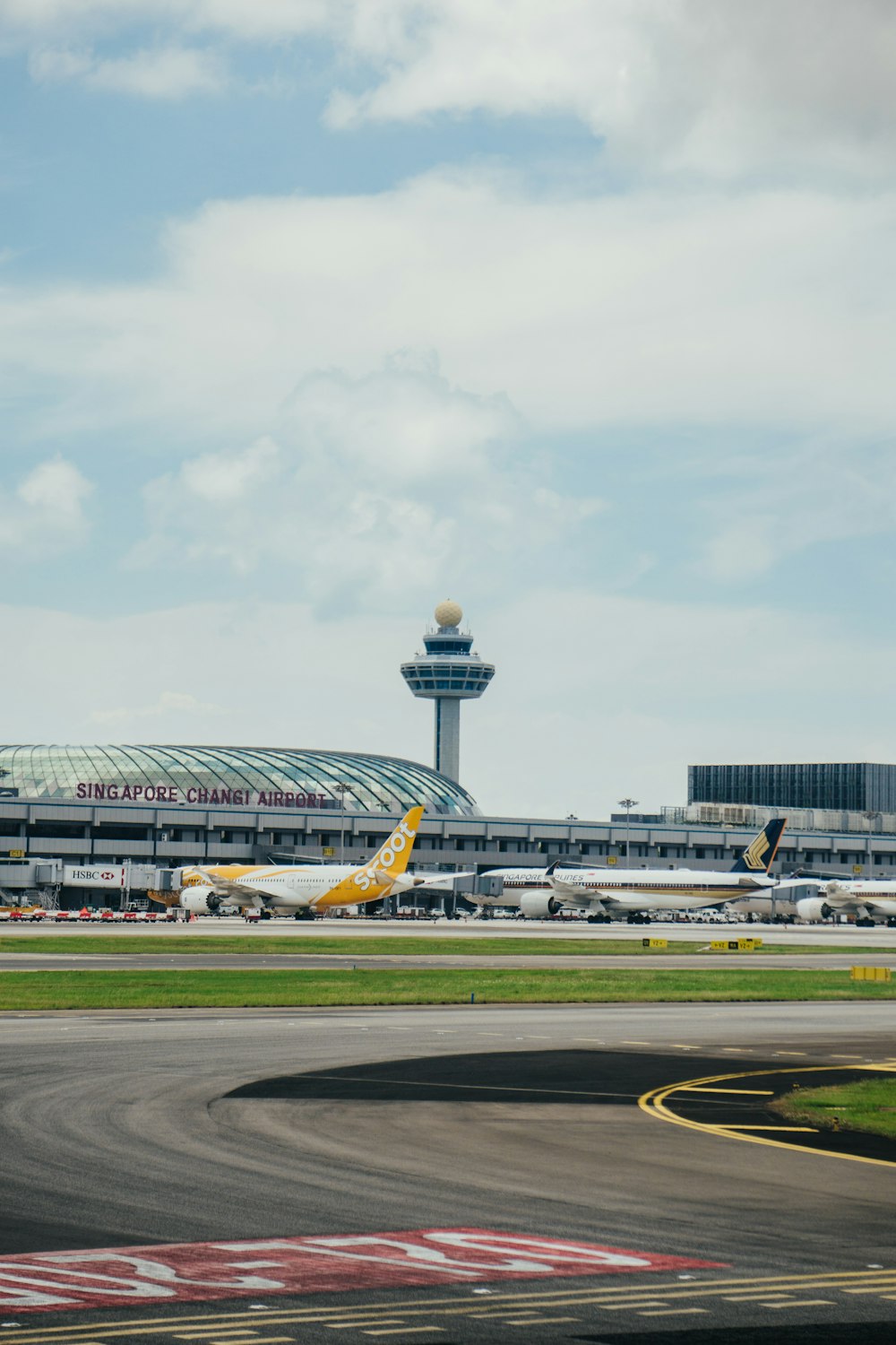 yellow and blue airplane on airport during daytime