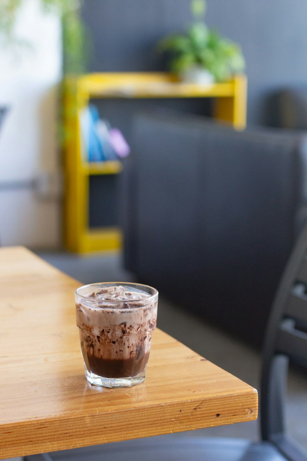 clear plastic cup on brown wooden table