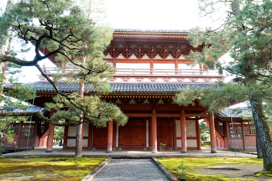 brown and white concrete building near green trees during daytime in Daitoku-ji Japan