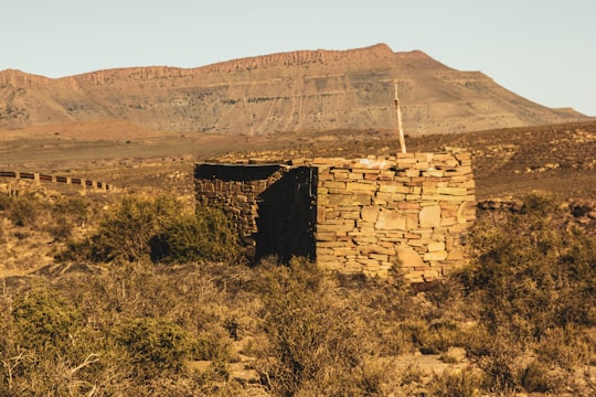 brown rock formation under blue sky during daytime in Fraserburg South Africa