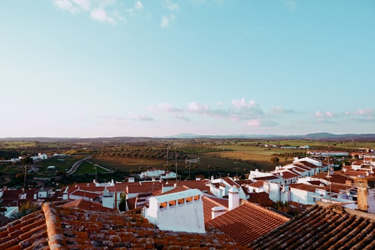white and brown houses under blue sky during daytime in Arronches Portugal