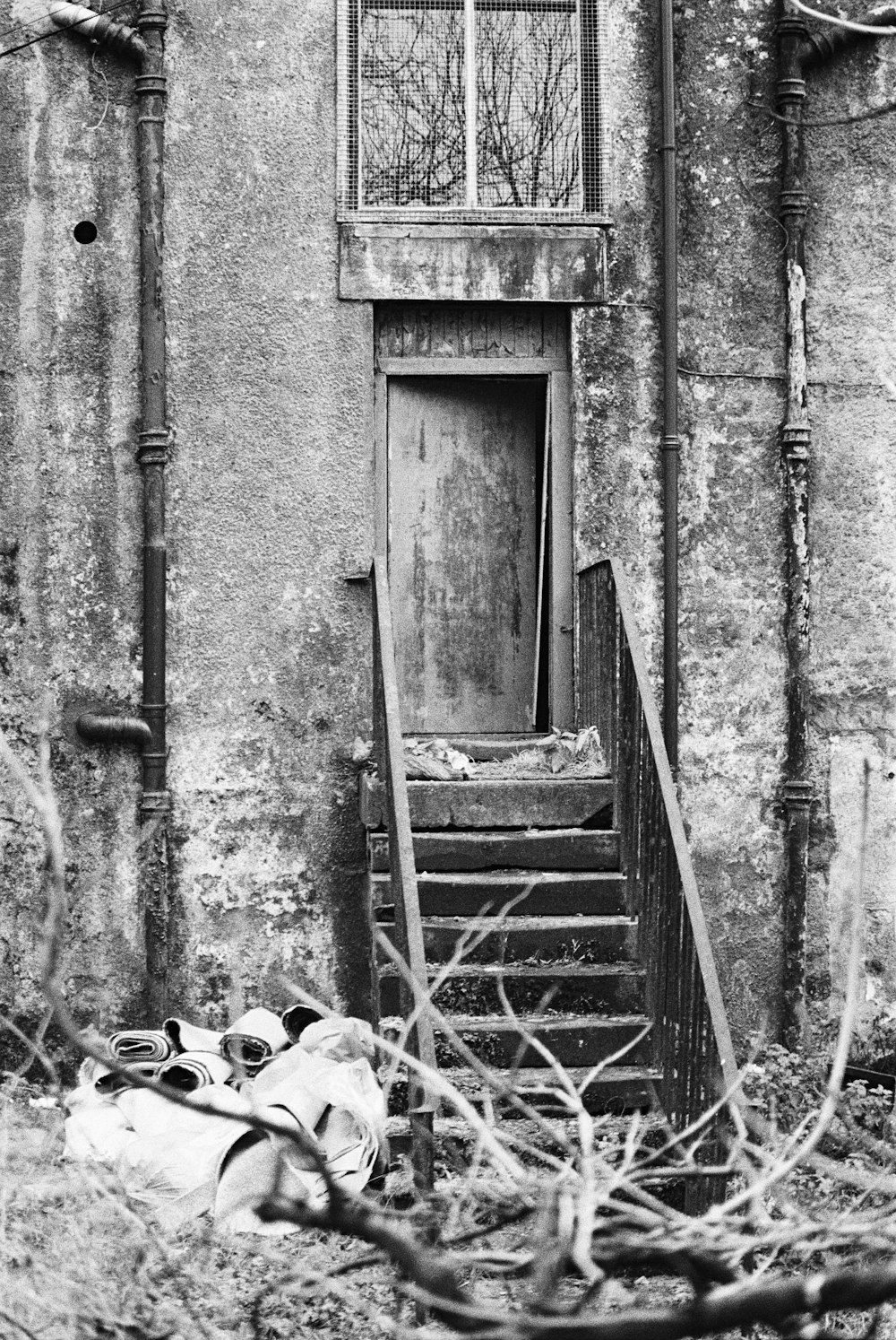 grayscale photo of wooden door