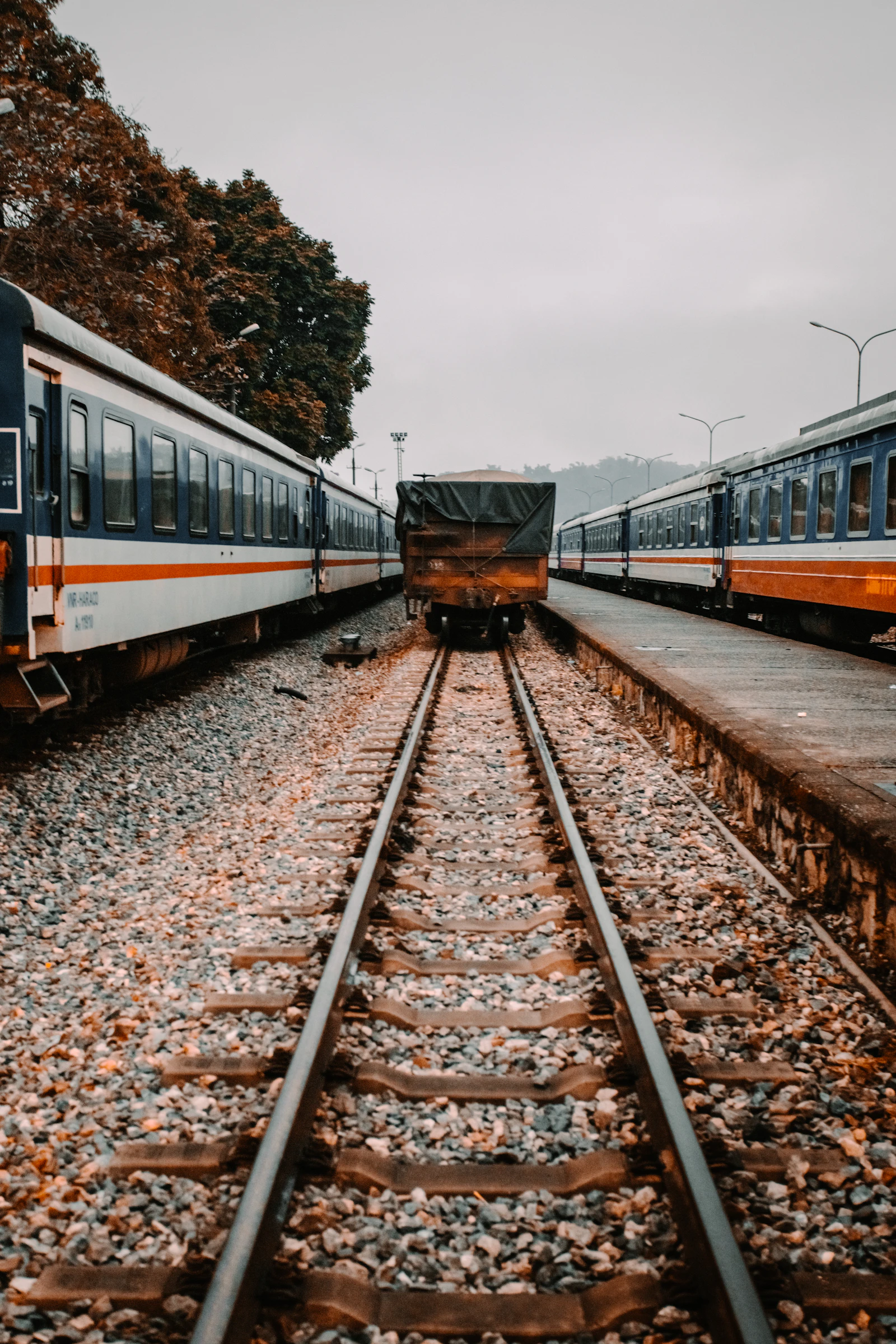 Passenger train travelling on railway tracks in northern Vietnam near the Sapa route