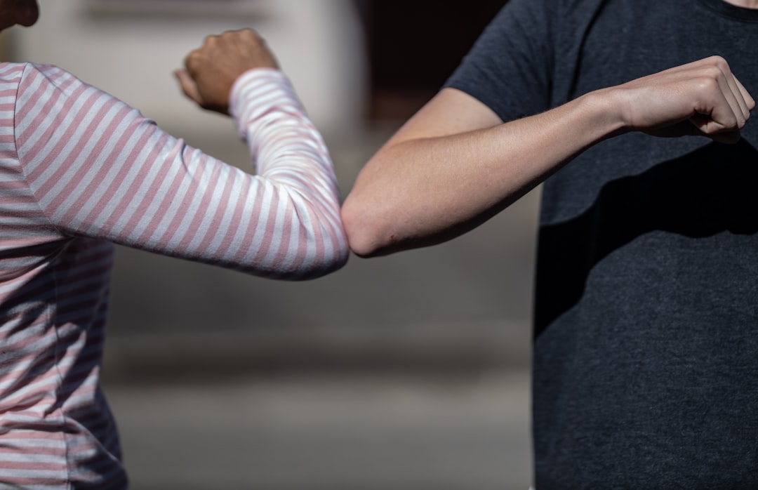 The elbow bump is an informal greeting where two people touch elbows. Interest in this greeting was renewed during the avian flu scare of 2006, the 2009 swine flu outbreak, the Ebola outbreak of 2014, and the 2019-20 COVID-19 pandemic when health officials supported its use to reduce the spread of germs.