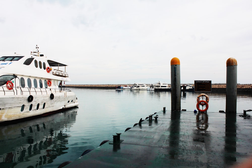 white boat on water during daytime