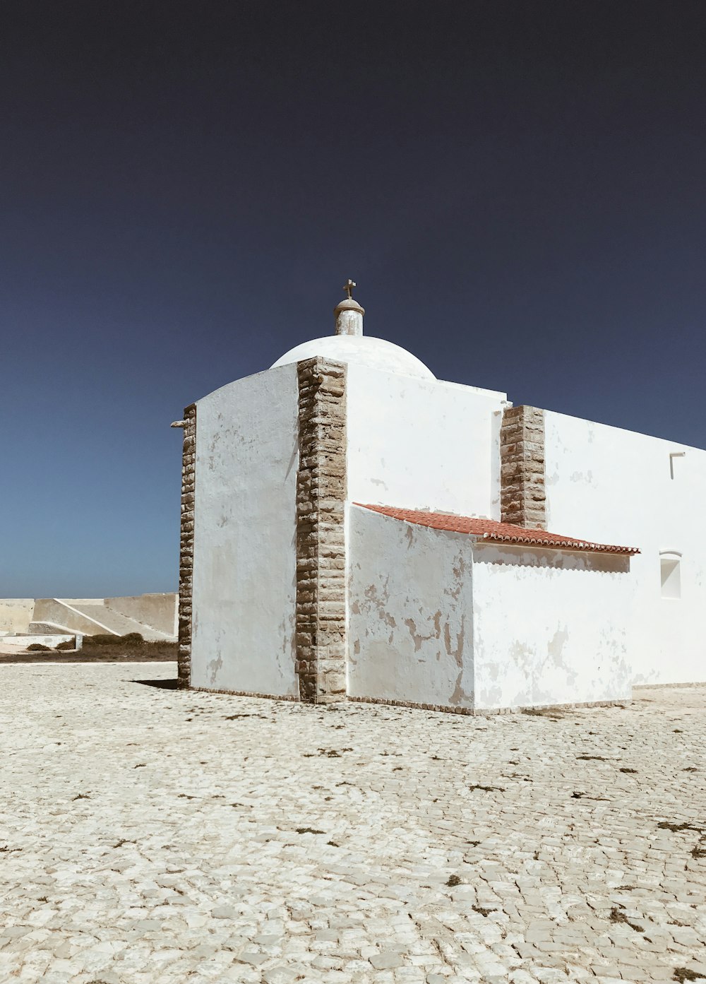 white and brown concrete building under blue sky during daytime