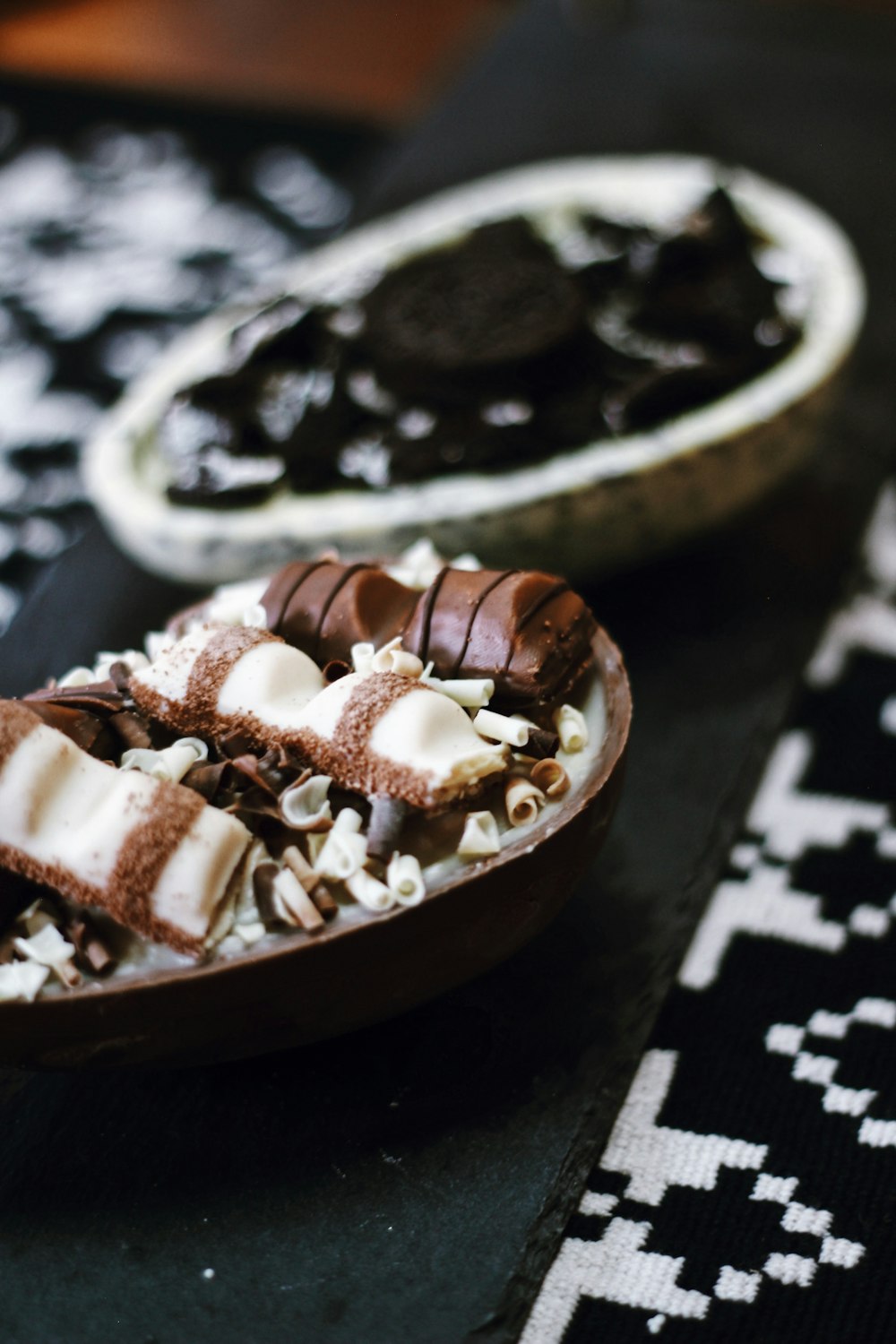 chocolate coated cookies on brown wooden round tray