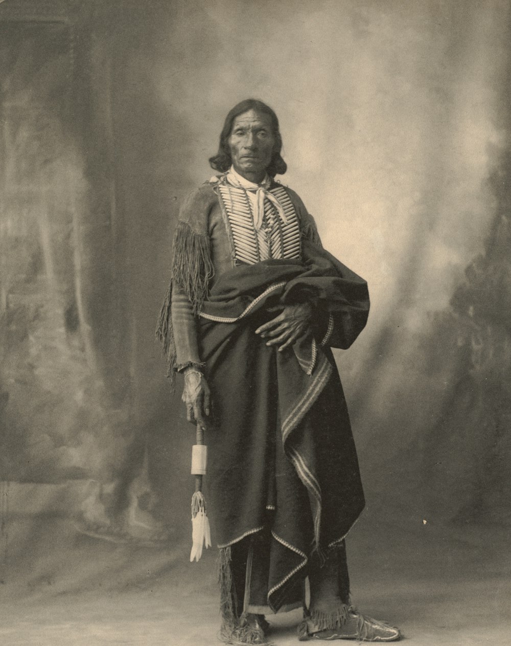 man in black robe standing