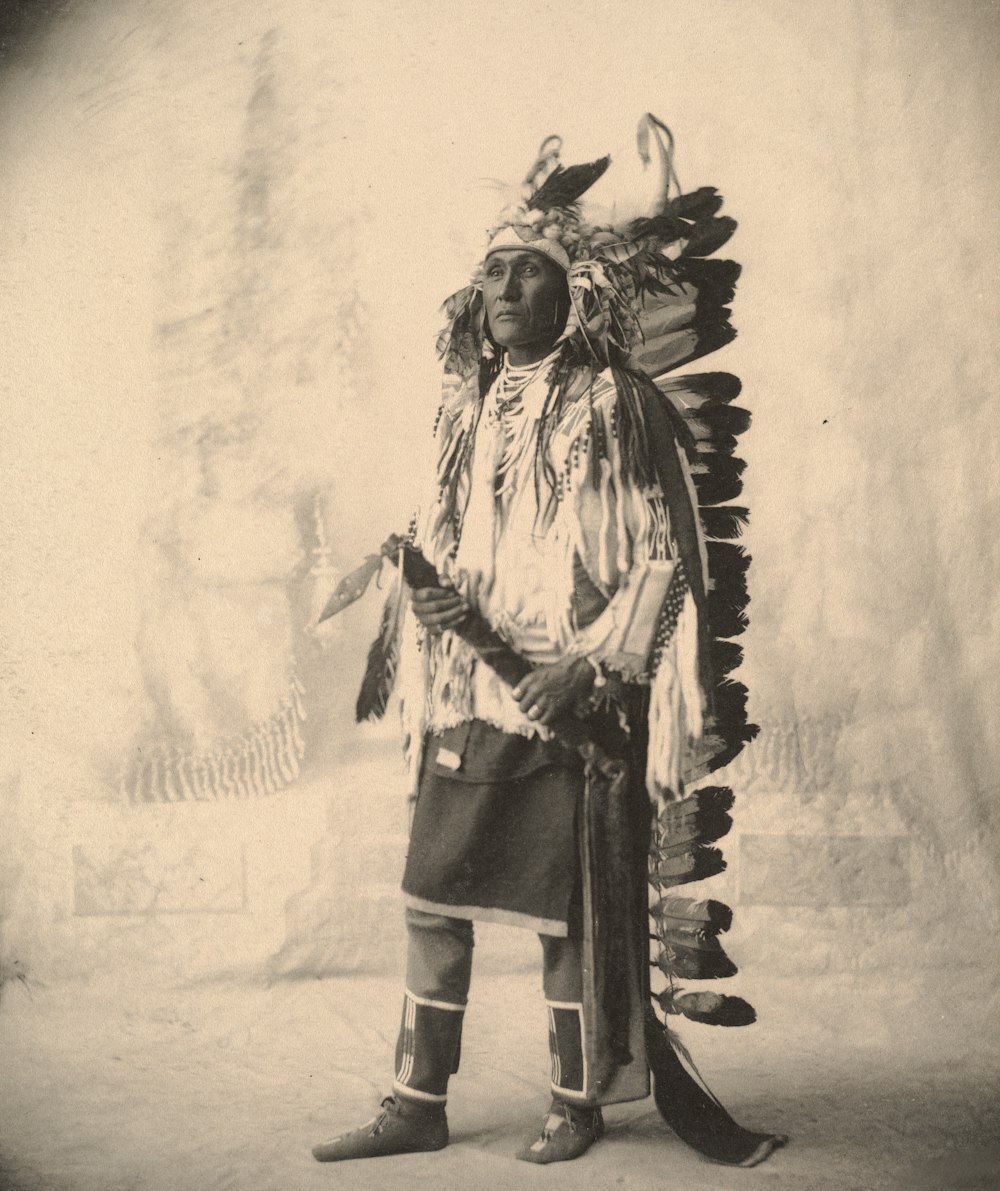 man in black and white costume standing